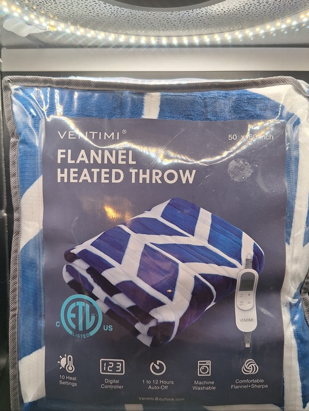 The Electric Blanket Heated 50" x 60" Throw in Navy and white
